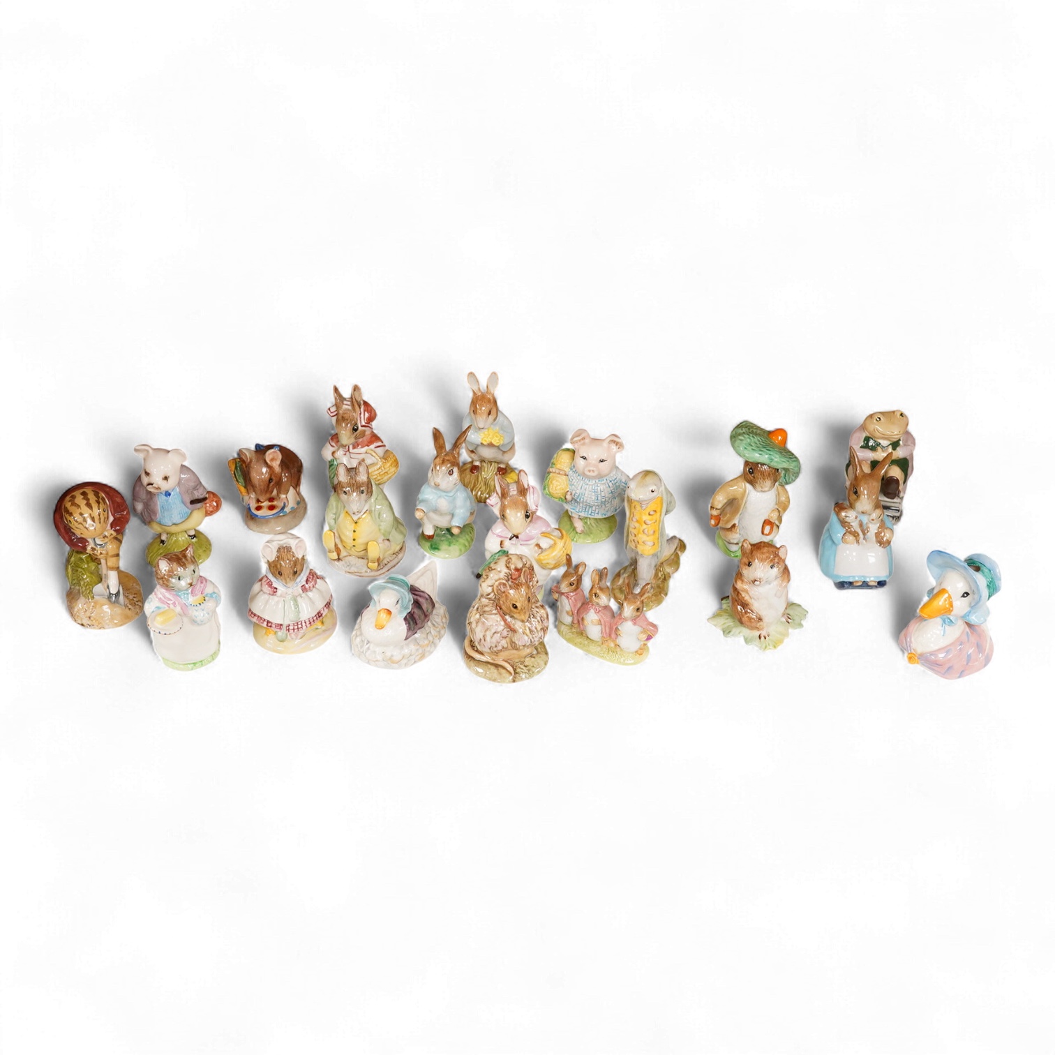 Twenty Beatrix Potter figures, mostly later production figures, largest 11cm high
